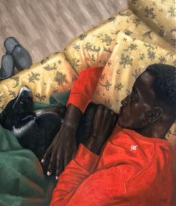 boy with a dog on a sofa