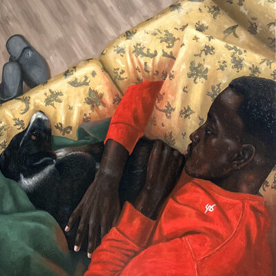boy with a dog on a sofa